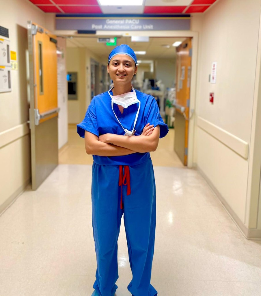 Dr. Monika Singh in surgical scrubs at the hospital